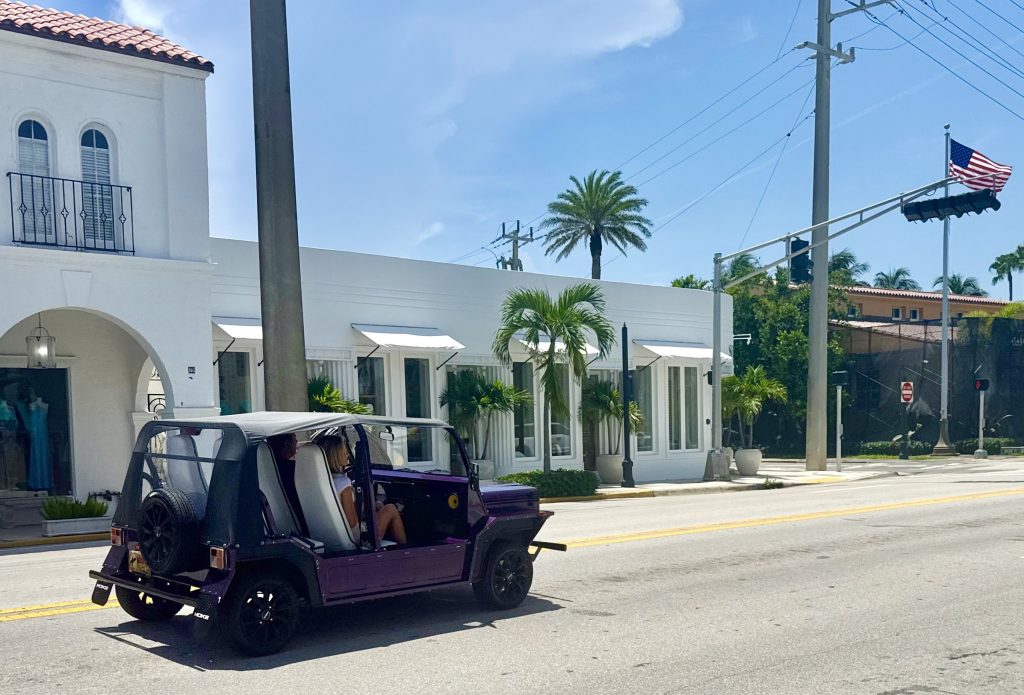 Moke electric car being driven in Palm Beach, Florida, ready for enclosed transport up the East Coast.